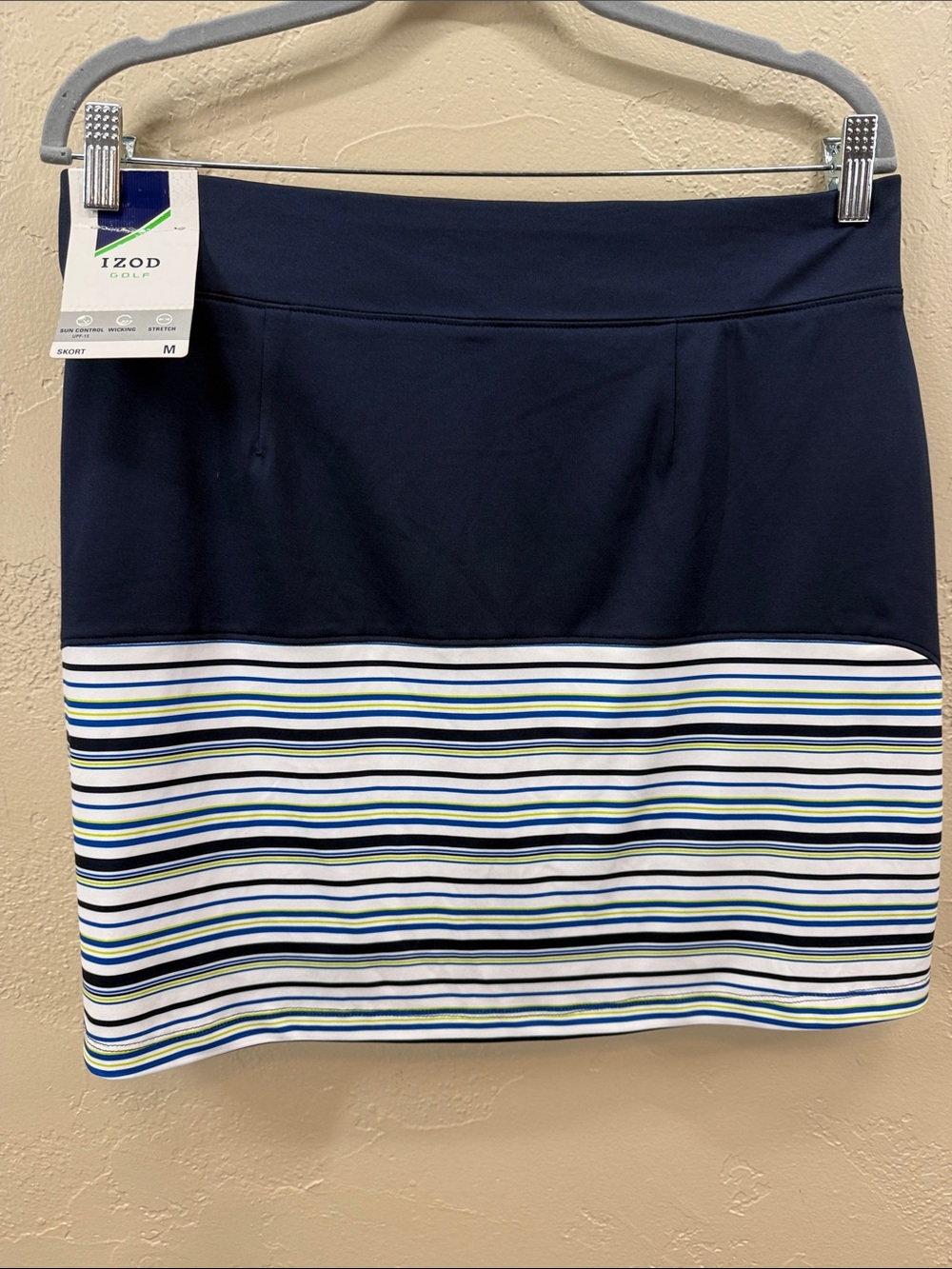 IZOD Golf Navy Skort with Stripe Accents. Side pockets. Undershorts. Size Medium